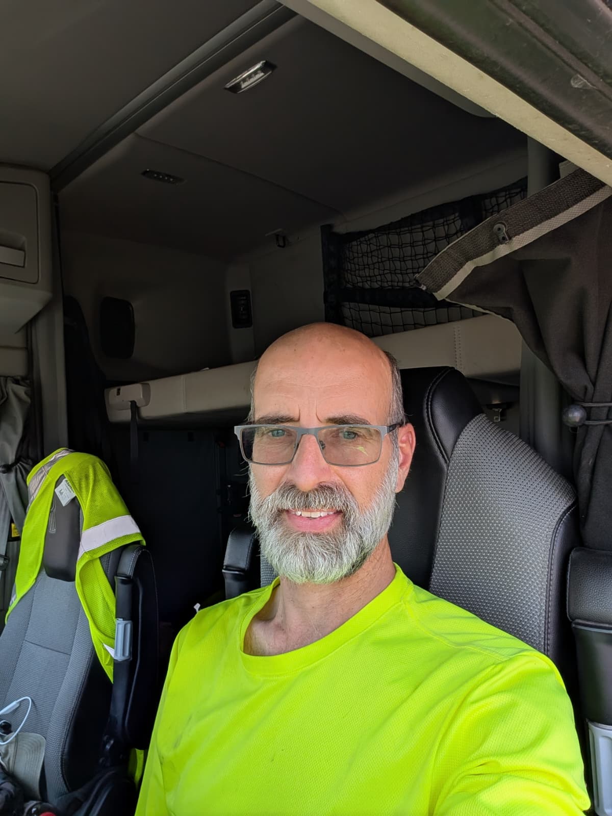Mark Simmons seated inside his semi truck